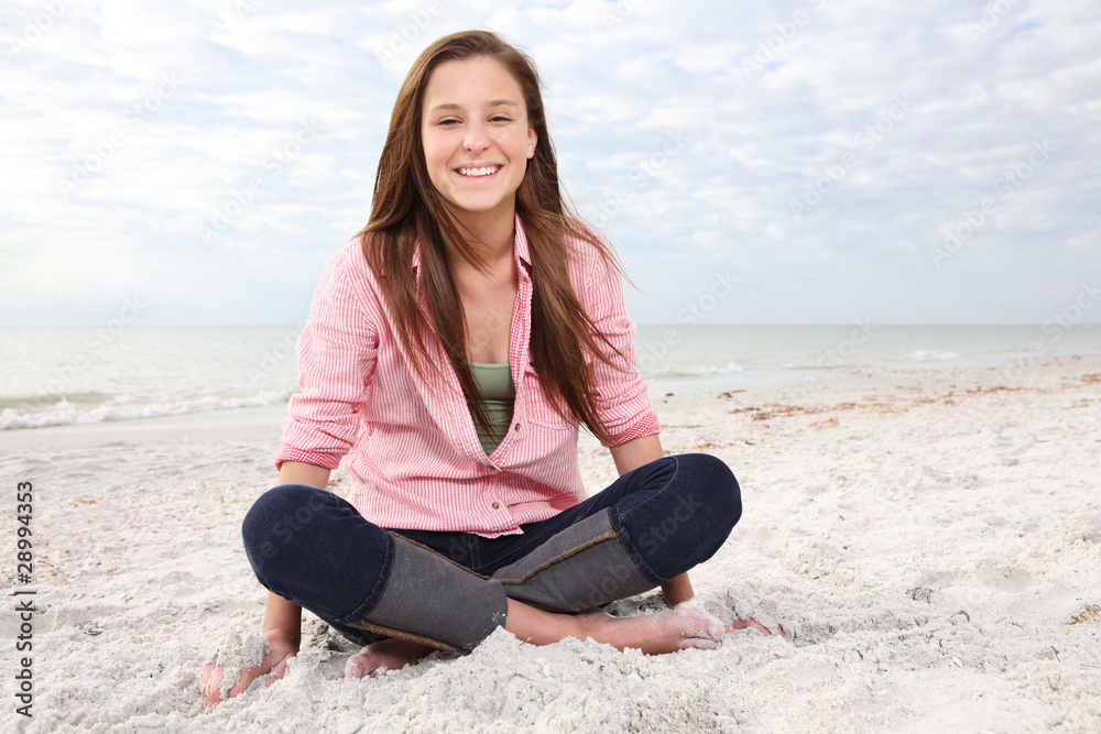 Girl enjoys summer day at the beach.