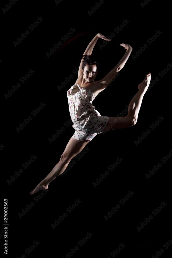 Girl in dancing pose in air