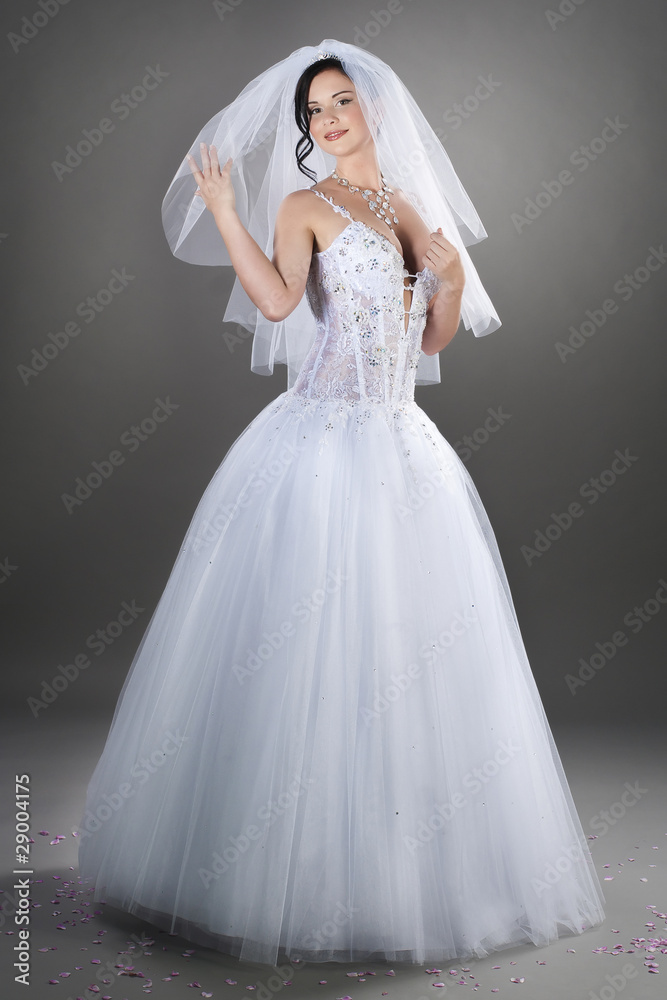 pretty young bride wearing traditional white wedding outfit pretty young bride wearing traditional white wedding outfit