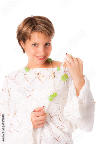 Beautiful girl in a white knitted pullover photo