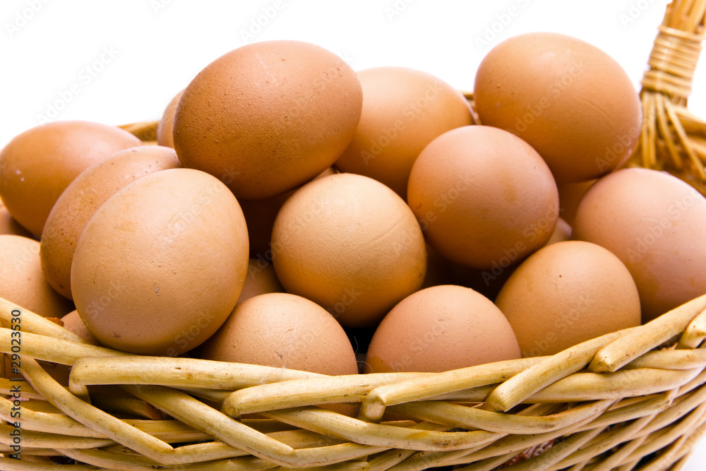 Eggs in basket on white background Eggs in basket on white background