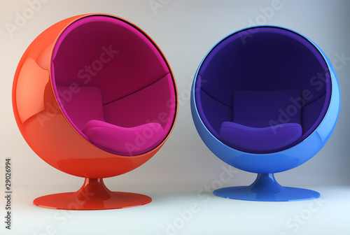 Two multi colored armchairs opposite each other