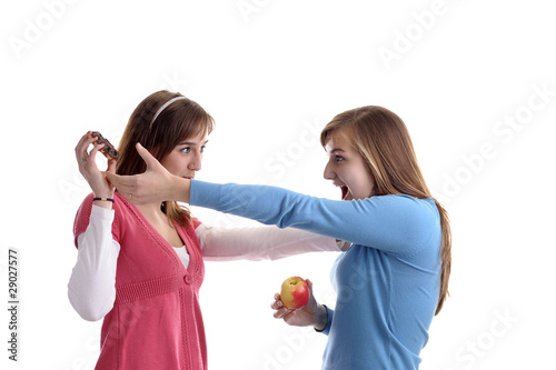 two young women fighting for a wafel