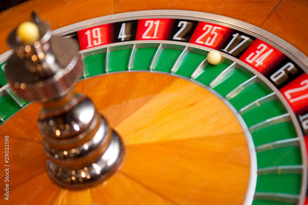 casino roulette close up with the ball on number zero casino roulette close up with the ball on number zero