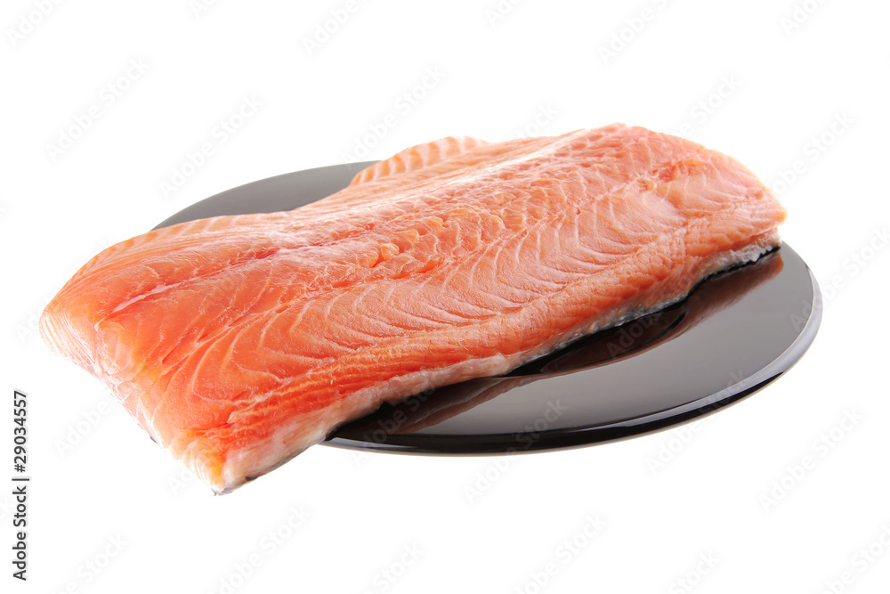 fresh raw salmon fillet on black