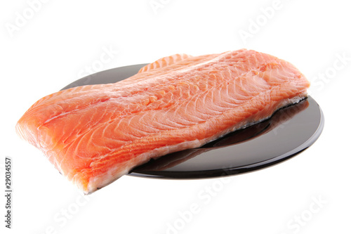 fresh raw salmon fillet on black