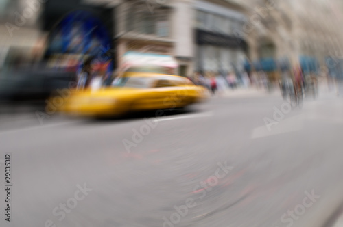 Famous New York yellow taxi cabs in motion - intentional blur