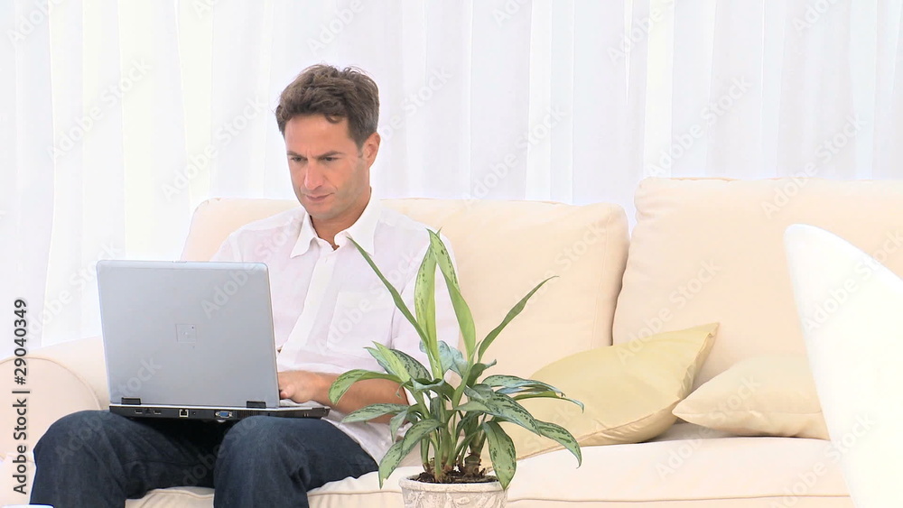 Serious man working on his laptop Serious man working on his laptop