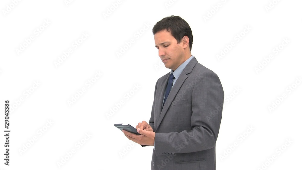 Serious businessman using a computer tablet Serious businessman using a computer tablet