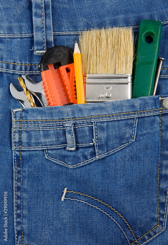 tools and instruments in jeans pocket photo