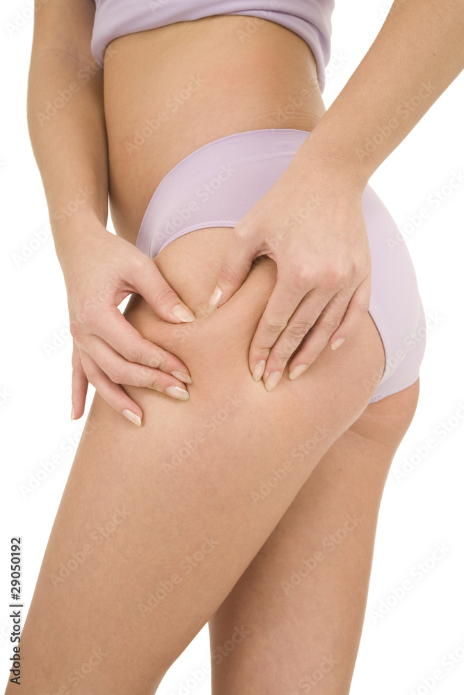woman controls the cellulite on the thighs