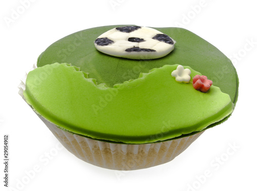 Cupcake with soccer bal isolated over white