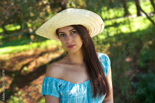 Girl in blue dress and hat