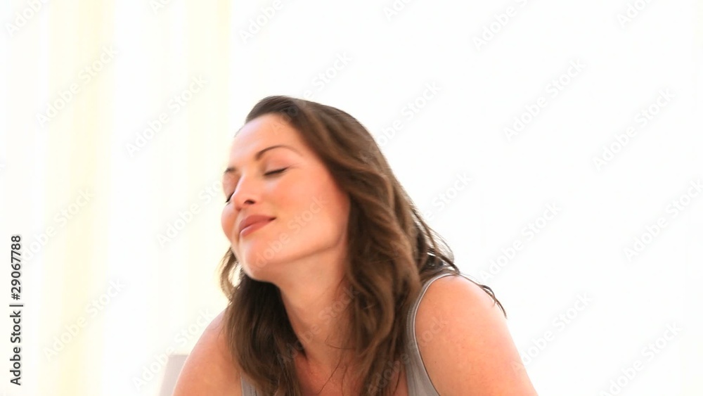 Woman laughing before drinking a coffee at home Woman laughing before drinking a coffee at home