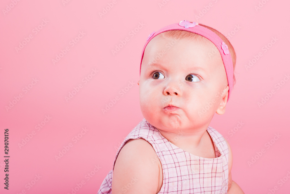 Portrait of the beautiful serious girl on a pink background Portrait of the beautiful serious girl on a pink background