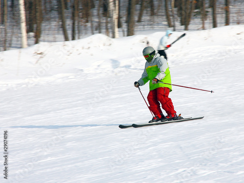 The skier quickly goes from mountain