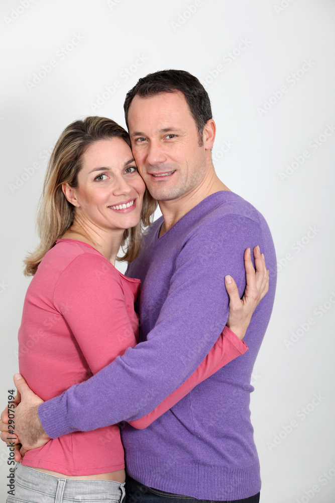 Couple embracing each other on white background