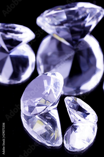 Crystal gemstones on black mirror