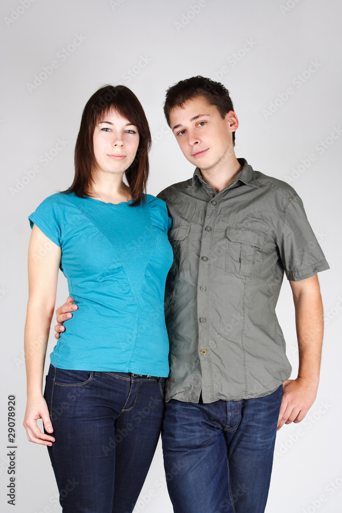 portrait of man embracing brunette girl and looking at camera portrait of man embracing brunette girl and looking at camera