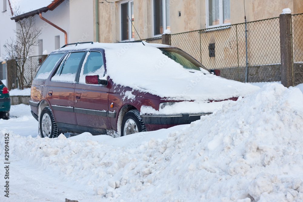 car under winter snow