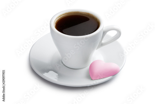 Cup of coffee with pink heart shape cookie