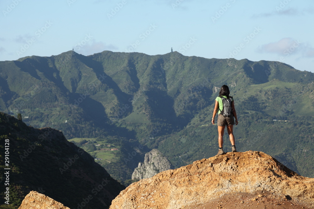 Woman hiker viewing central peaks on St Helena