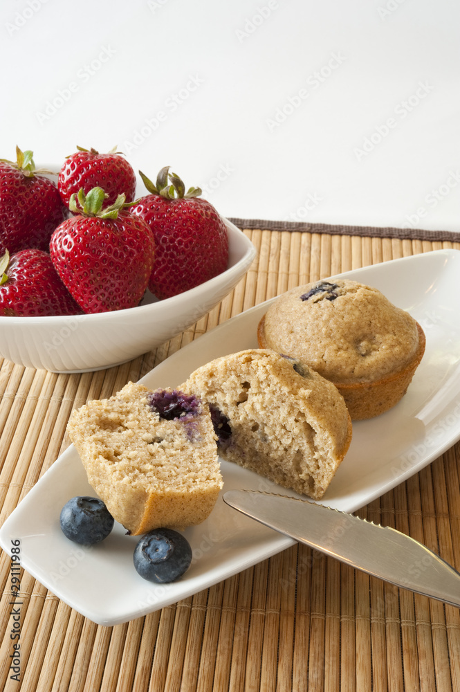 Blueberry Muffins with Bowl of Strawberries Blueberry Muffins with Bowl of Strawberries