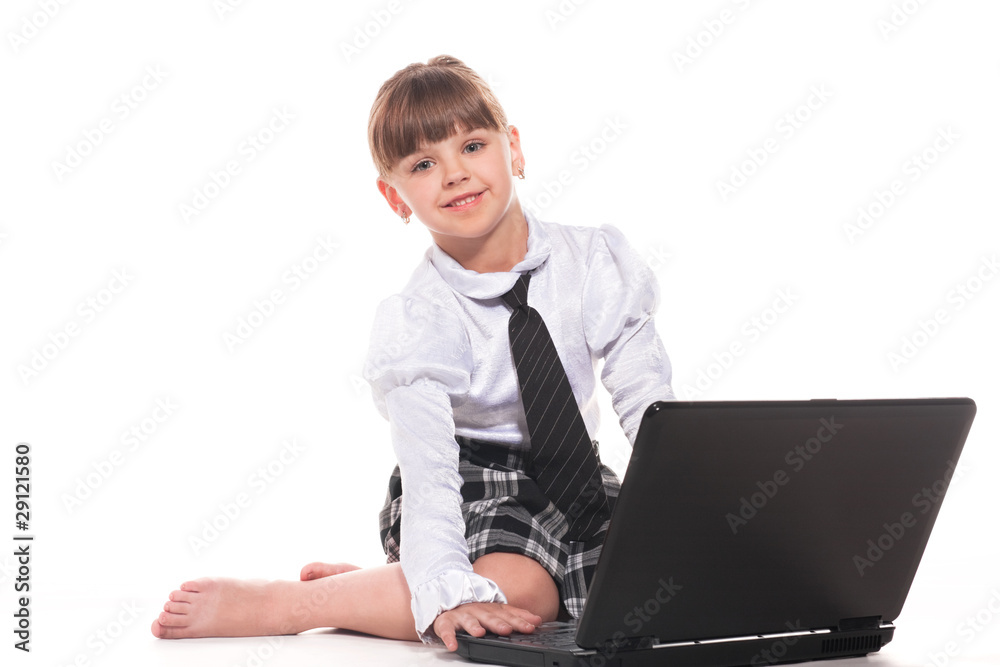 Attractive little girl with laptop