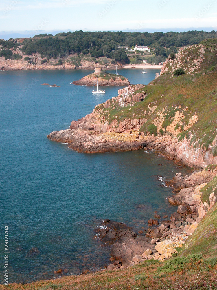 Yachts moored in the sandy cove of Portelet Bay, Jersey