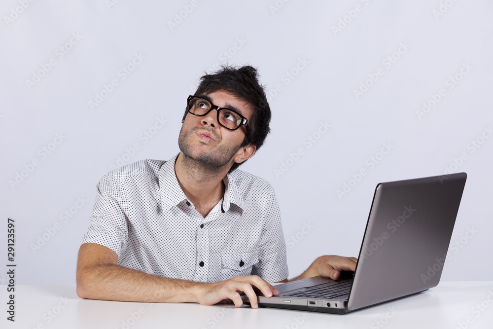Young man working with his laptop Young man working with his laptop