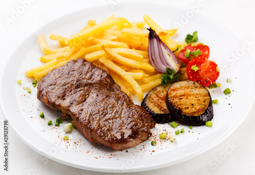 Steak with chips and vegetables