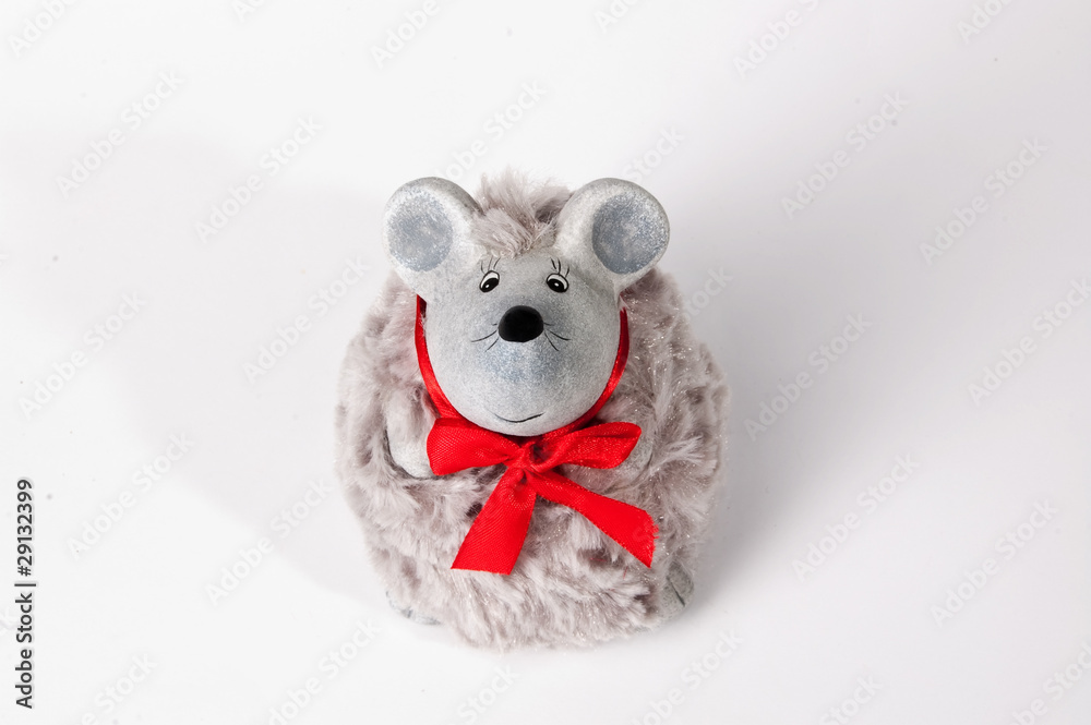 a toy of a gray mouse with red ribbon a toy of a gray mouse with red ribbon