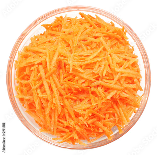 Uncooked carrot in a bowl on white background