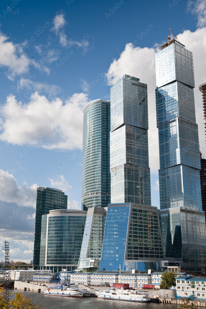 Many scyscrapers of Moscow city under blue sky