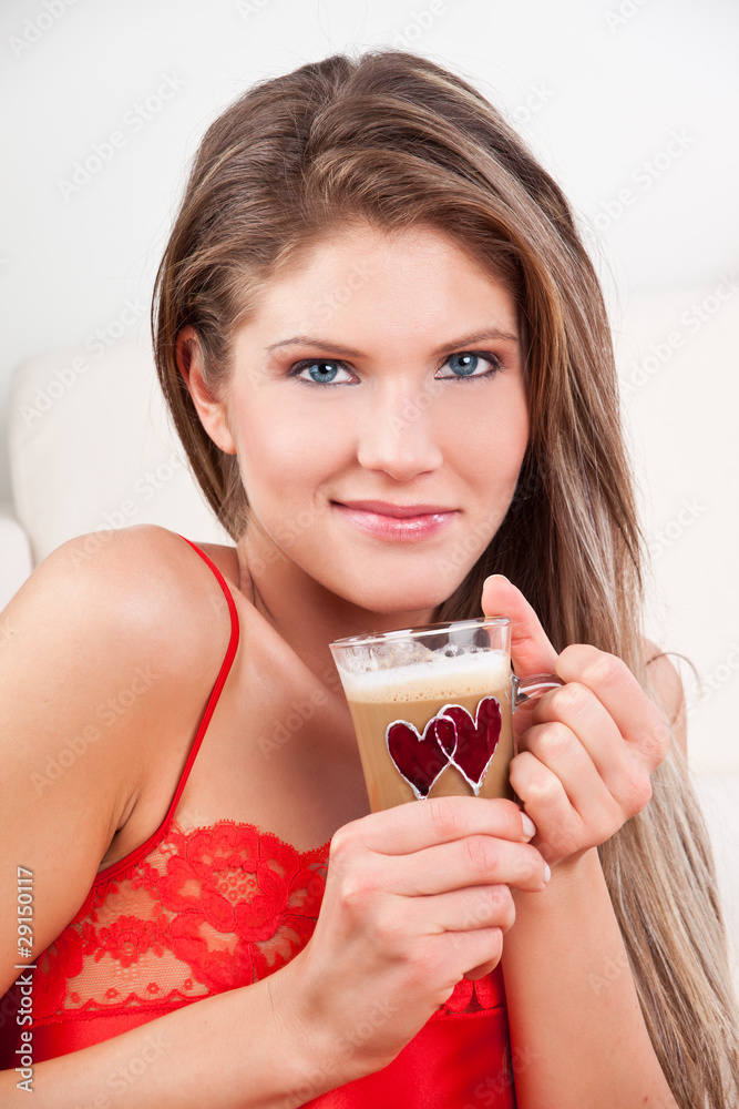 Beauty, young girl holding a cup of coffee and smiling Beauty, young girl holding a cup of coffee and smiling
