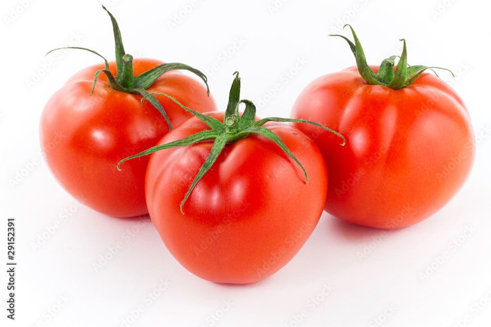 Fresh juicy tomatoes isolated on white