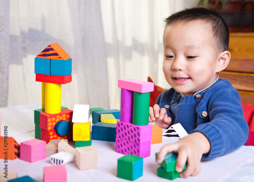kid with toy blocks kid with toy blocks
