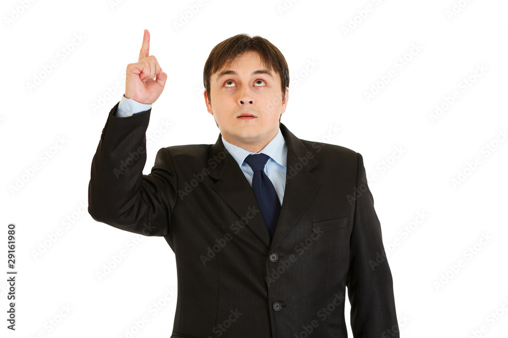 Interested modern businessman pointing finger up isolated Interested modern businessman pointing finger up isolated
