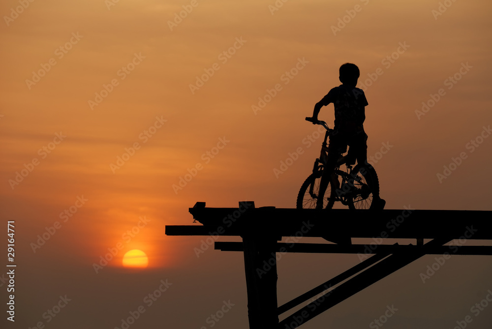 A boy sitting on bicycle 3