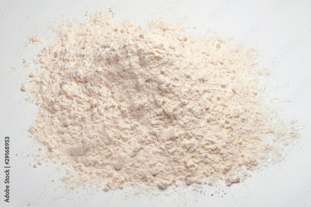 Wheat flour heap on a white background Wheat flour heap on a white background