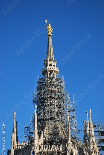 Gothic cathedral of Milan, holy Mary statue, Lombardy, Italy © Crisferra