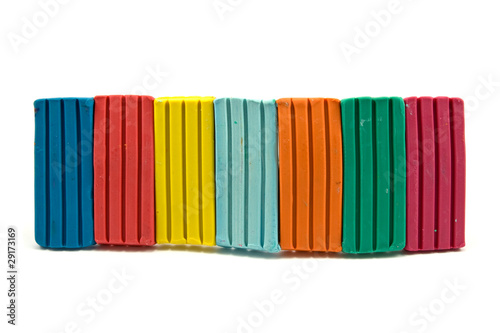 row of colorful plasticine on white background © graja