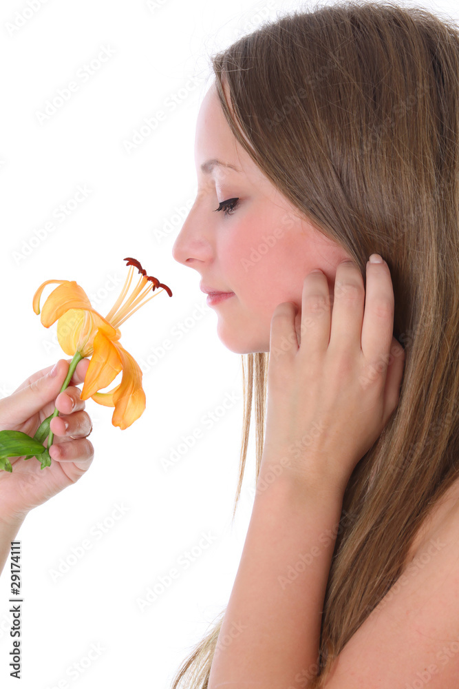 Beautiful woman smelling flower isolated on white Beautiful woman smelling flower isolated on white