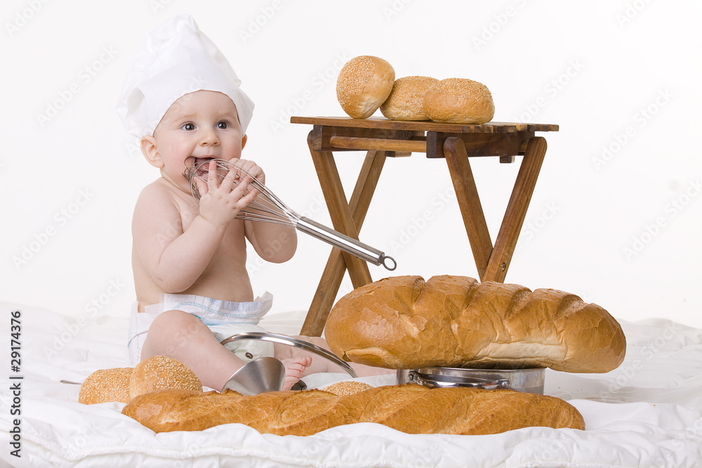 little baby chef, baguettes and bread on white background