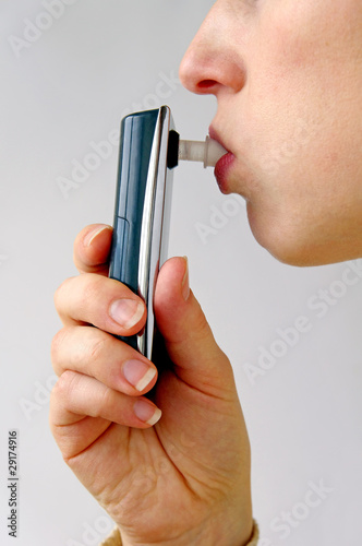 Alcoholometer - Women perform a test of alcohol