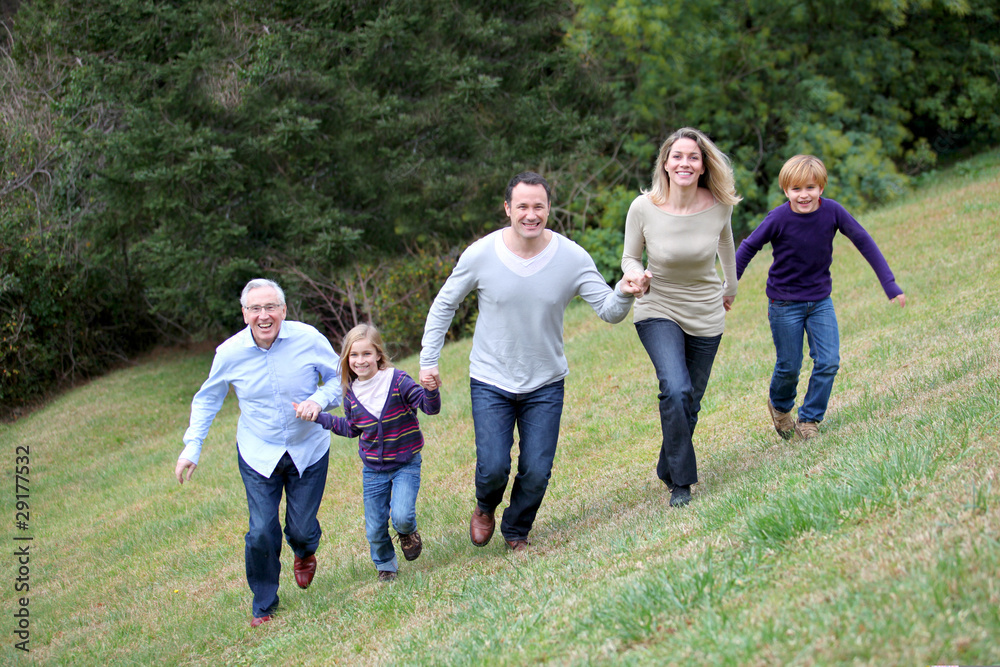 Family having fun running in park Family having fun running in park