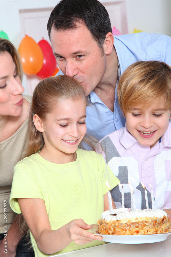 Family celebrating child's birthday Family celebrating child's birthday
