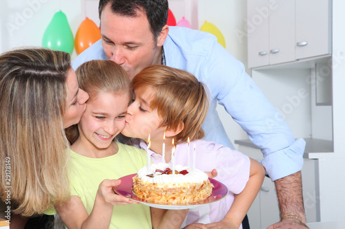 Family celebrating child's birthday