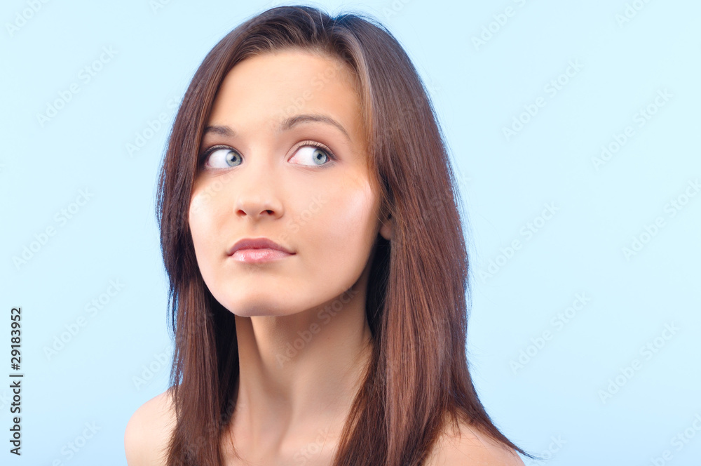 beautiful happy woman is looking sideways and touching her face beautiful happy woman is looking sideways and touching her face