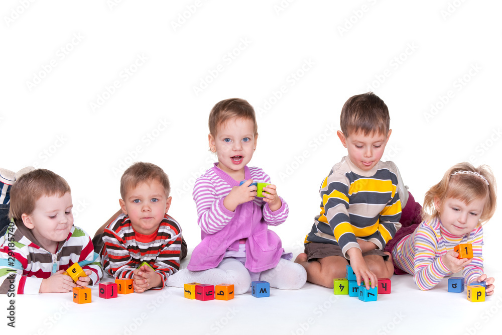 Five children playing blocks